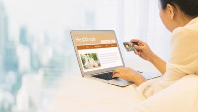 About Savvy Perks, Woman Paying for Spa on Home Computer