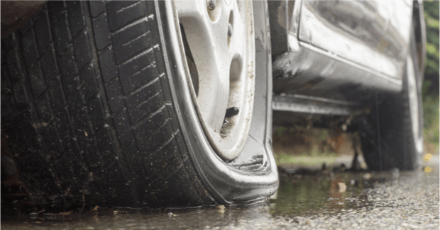 Goodyear, Flat Tire on Rainy Day