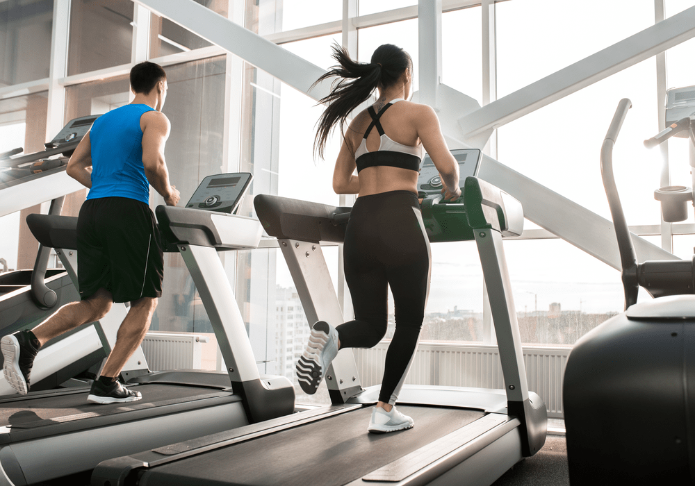 Retro Fitness Man and Woman on Treadmill